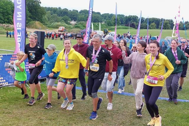 A BRR contingent cross the finish line at Endure 24.