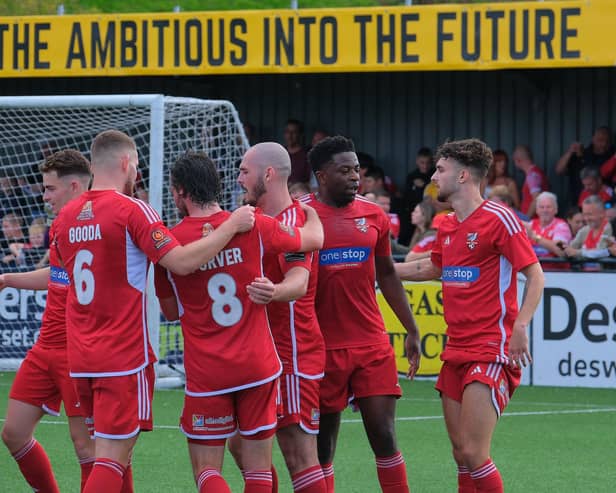 Mulhern celebrates his second goal making it 3-0 at the break.