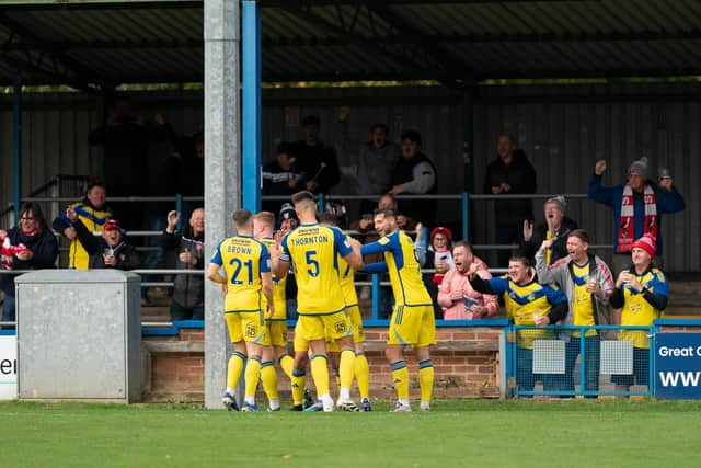 Boro fans celebrate Alex Purver's superb goal with their supporters at King's Lynn Town. Photo by Wandering Photography