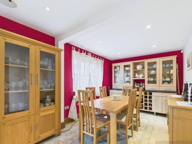 The dining room has plenty of space for a larger style table and chairs.