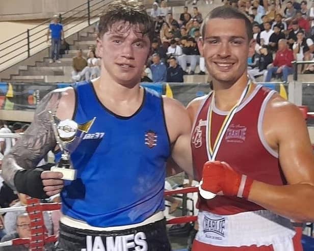Bridlington's James Precious shows off his trophy after winning his fight in Tenerife.