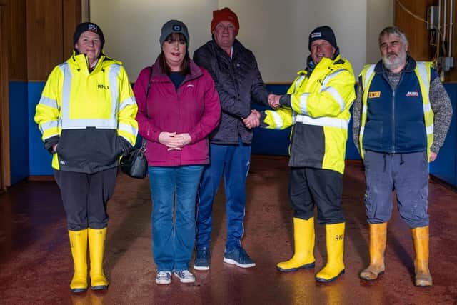 Launch Authority, Martin Hopkinson, accepting the donation made in memory of David Holland from David's son Steven.  picture: RNLI/James Stoker
