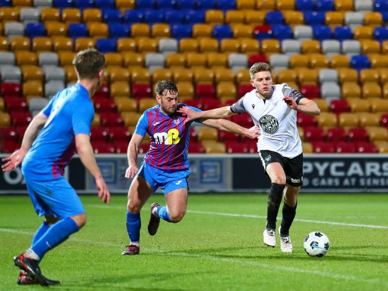 Jake Charles looks to force his way upfield