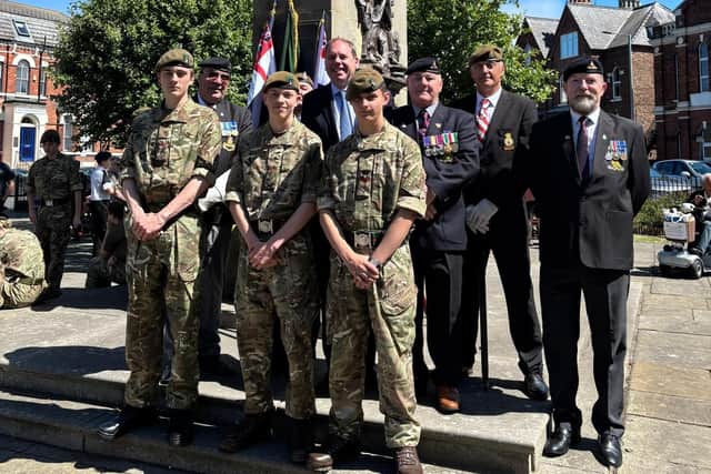 Charlie Dewhirst MP with veterans and cadets at the war memorial.