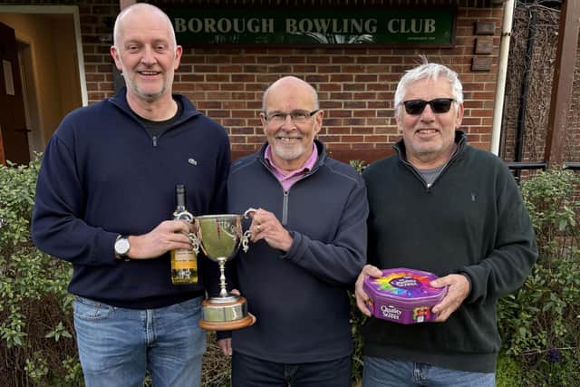 Andy Adamson, left, is presented with the Potter Cup win by Borough Bowling Club President Shaughan Temple, with runner-up Simon Walker, right.