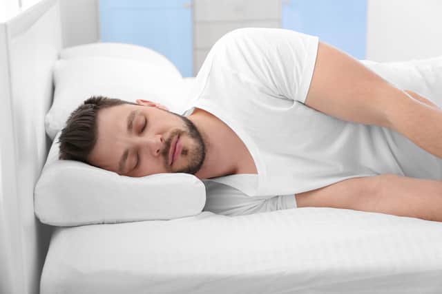 Using a neck support pillow or a memory foam pillow can help support the head or neck. Photo: StockAdobe