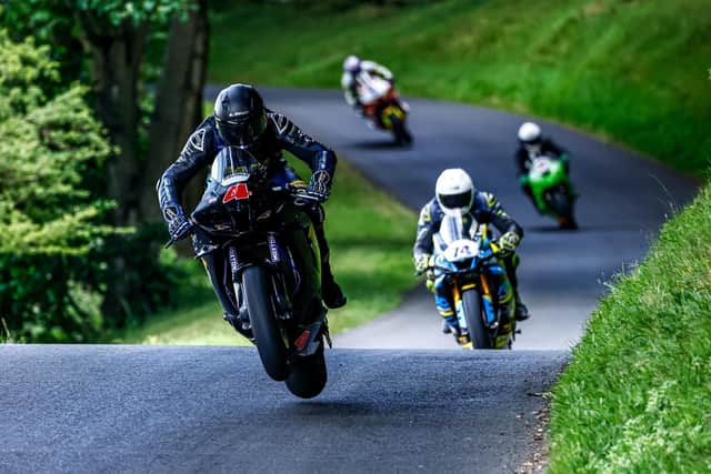 John Marsh (no 4) leads David McArthur (no 74) during the Barry Sheene Festival at Oliver's Mount. Photo by David Garrison
