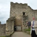 HIstorian and former teacher John Smith outside Pickering Castle which inspired his medieval stories