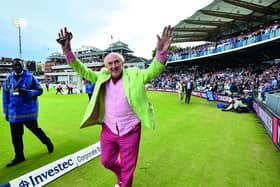 BBC radio commentator Henry Blofeld does a lap of honour after finishing his final radio commentary on the third day of the third international Test match between England and West Indies at Lord's cricket ground in London on September 9, 2017