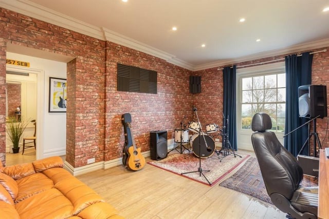 The sound-proofed music room forms part of what could be a self-contained wing of the house.