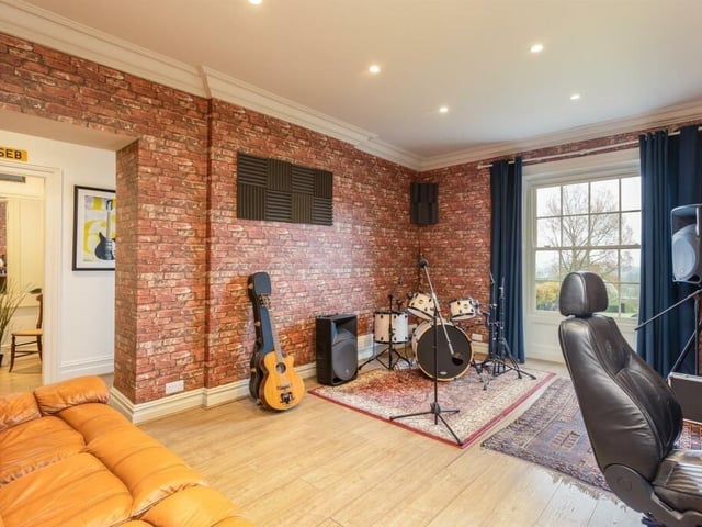 The sound-proofed music room forms part of what could be a self-contained wing of the house.