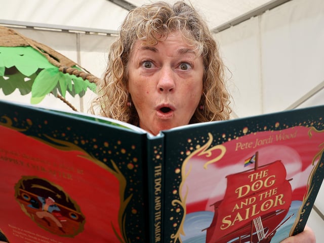 Adele Duffield from Whitby Library enjoys a sea-themed book. photo: Richard Ponter