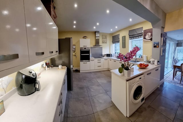 A modern and spacious, open plan kitchen.