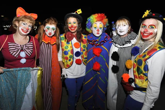Fundraisers dress up as clowns for Saint Catherine's Hospice Midnight Walk.