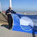 Coun Barbara Jefferson and Jonathan Newman, foreshores inspector, are joined by Hornsea Mayor Councillor Laura Embleton and her consort Colin Embleton, proudly displaying the 2024 Blue Flag for Withernsea