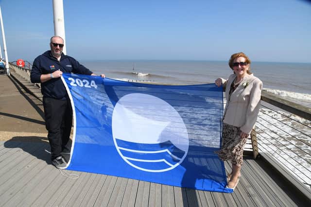 Coun Barbara Jefferson and Jonathan Newman, foreshores inspector, are joined by Hornsea Mayor Councillor Laura Embleton and her consort Colin Embleton, proudly displaying the 2024 Blue Flag for Withernsea