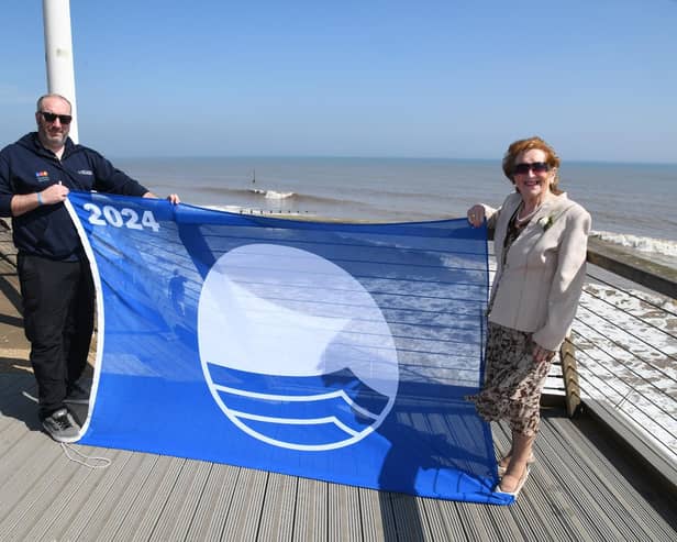 Coun Barbara Jefferson and Jonathan Newman, foreshores inspector, are joined by Hornsea Mayor Councillor Laura Embleton and her consort Colin Embleton, proudly displaying the 2024 Blue Flag for Withernsea