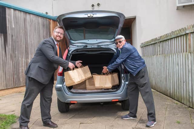 Neil Bradbury, CEO at AGE UK Scarborough and District with Doug getting deliveries organised