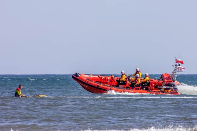 Staithes and Runswick RNLI along with Runswick Bay RNLI lifeguard at the opening of the 2023 lifeboat weekend. Image: RNLI/James Stoker