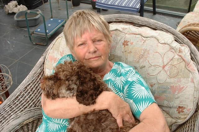 Patricia Wainman at home with Reggie