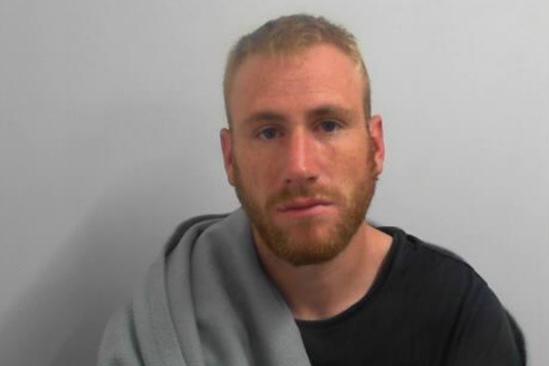 Ben Adams, 28, from Cayton near Scarborough, is wanted for breaching a restraining order