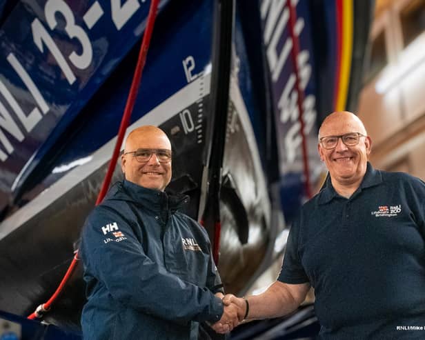 Jake Bennet (left) takes over as Lifeboat Operations Manager from Steve Clarke (right). Image: RNLI/Mike Milner