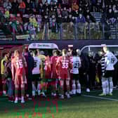 Darlington and Scarborough Athletic players leave the field along with the match officials. Match report: p62  PHOTO BY RICHARD PONTER