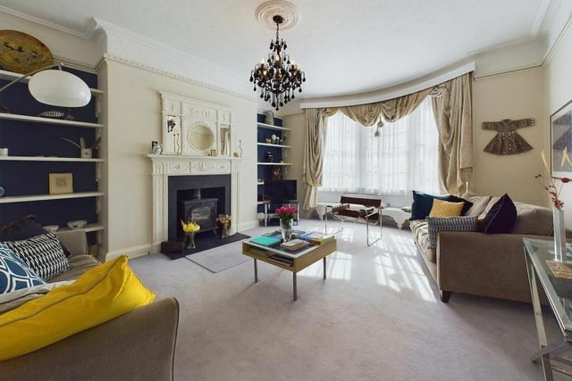 One of the stunning reception rooms with large feature fireplaces.