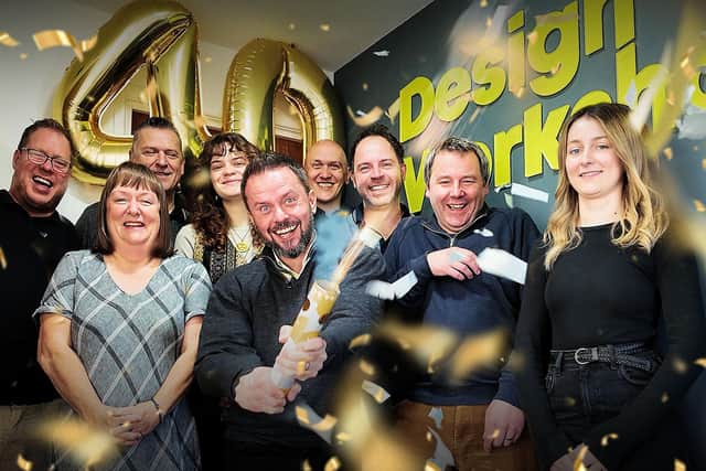 Managing Director, Ian Croney, and Director James McWilliam celebrate with the DW team