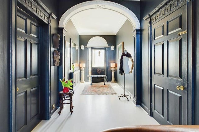 An impressive hallway with decorative arch features.