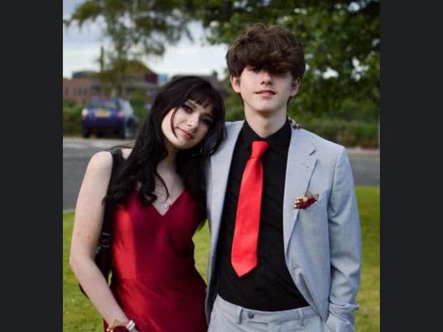 A gorgeous couple matching in red.