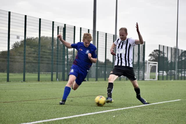 The hosts battle for the ball with Hornsea Town Reserves.