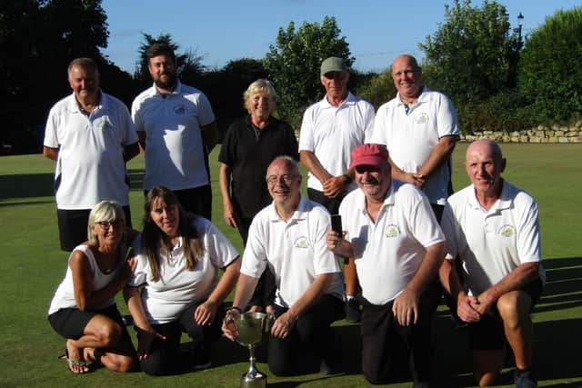 Whitby’s player celebrate winning the Knock Out Cup final against Hunmanby.