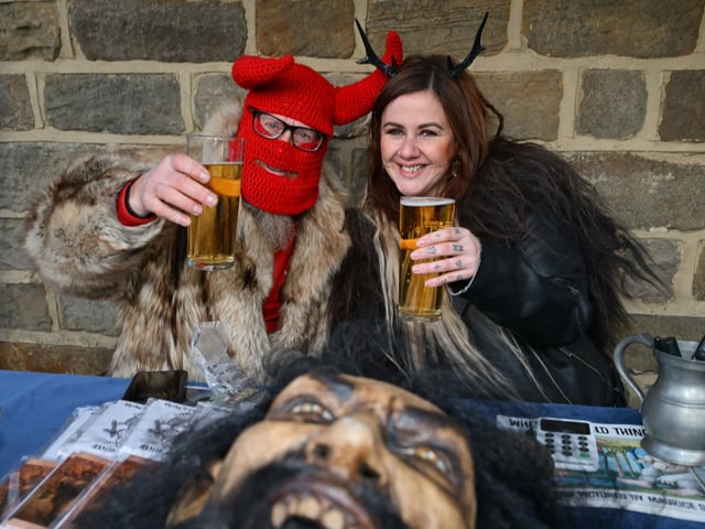 Cheers! Enjoying a pint at the festival.