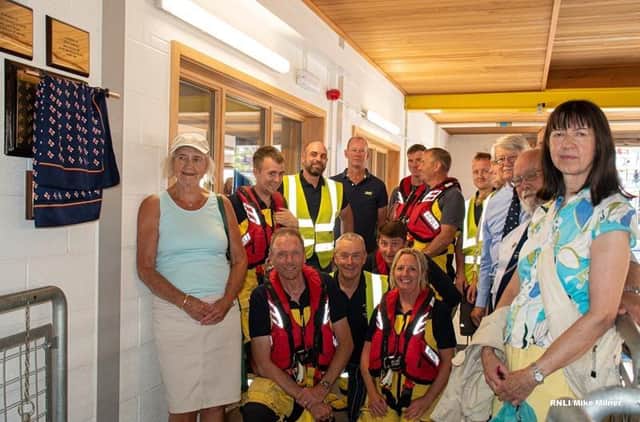 Judith and Diana with volunteer crew at unveiling of plaque at Bridlington Lifeboat Station. Photo: RNLI/Mike Milner