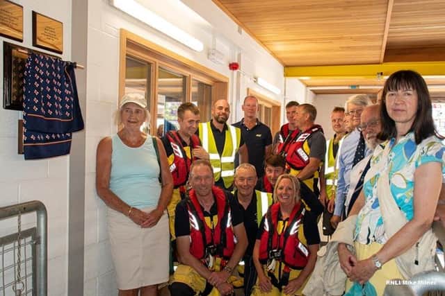 Judith and Diana with volunteer crew at unveiling of plaque at Bridlington Lifeboat Station. Photo: RNLI/Mike Milner