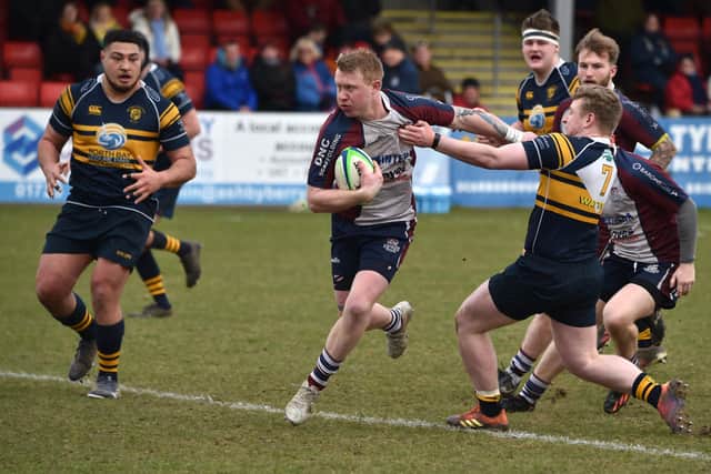 Brid try to get to grips with Scarborough's Joel Little.