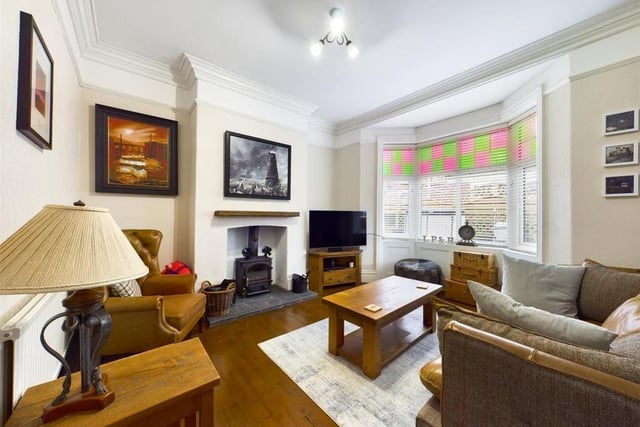 The lounge is another light and lovely room with a central fireplace and stove.