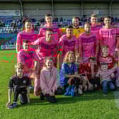 Whitby Town line up before their 0-0 draw with Leek Town in their pink kit. PHOTO BY BRIAN MURFIELD
