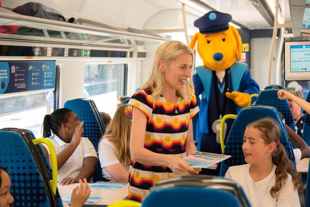 Comedian Sara Pascoe reading to children on a train in Yorkshire.