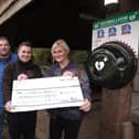 Cheque presentation at The Hayburn Wyke and new defibrillator installed - Mark Shaw and Darren Hainsworth of All Points Electrical with Keiron Hardwick representing the Air Ambulance and landlady Sharon Simpson. Pic: Richard Ponter