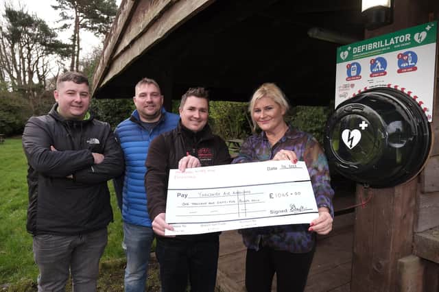 Cheque presentation at The Hayburn Wyke and new defibrillator installed - Mark Shaw and Darren Hainsworth of All Points Electrical with Keiron Hardwick representing the Air Ambulance and landlady Sharon Simpson. Pic: Richard Ponter