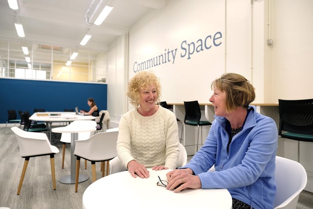 Enjoying a chat in the new community space.
