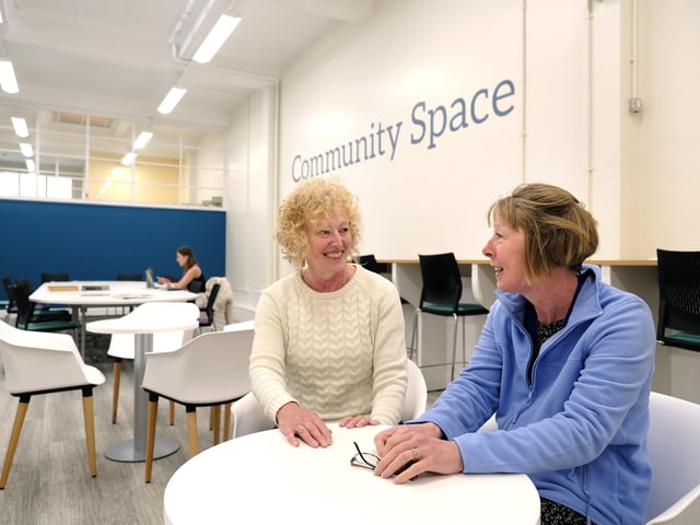 Enjoying a chat in the new community space.