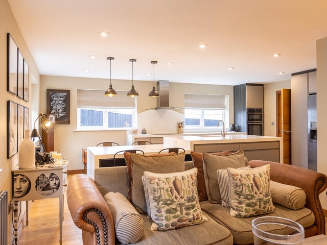 This living area is a flow-through from the dining kitchen.