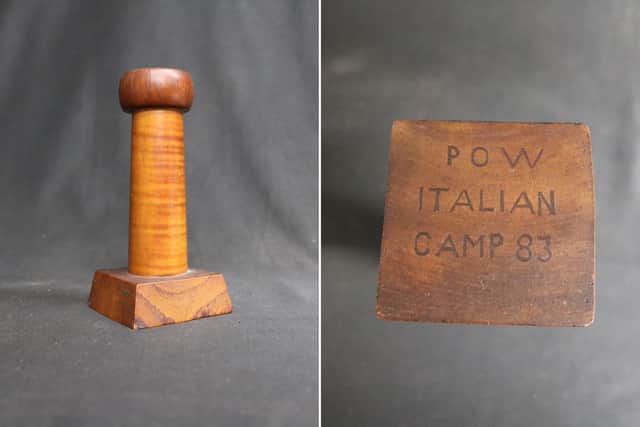 The donated wooden candle holder is engraved with “P.O.W. Camp 83”, which allowed Nick Mildwater to trace the artefact back to Eden Camp.