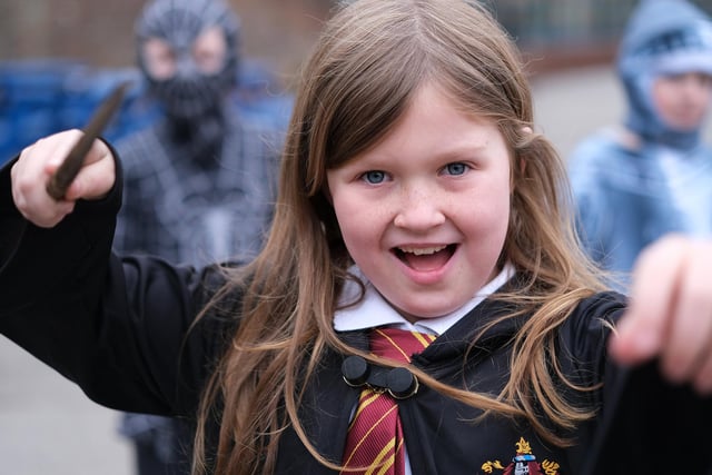 A Gladstone Road School pupil dressed as Harry Potter casts a spell.
picture: Richard Ponter