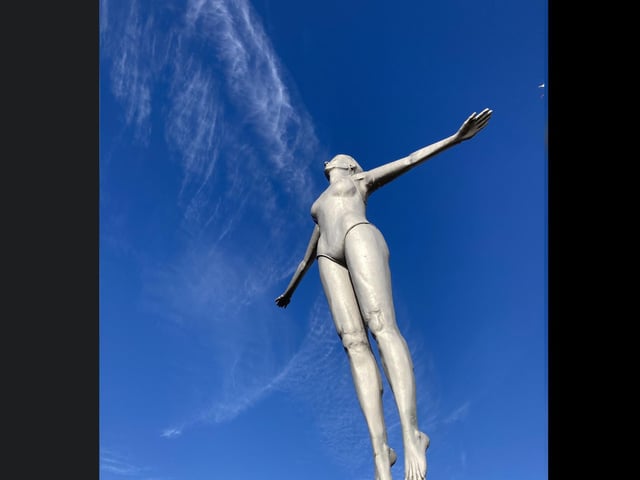 This statue looks lovely against the deep blue sky.