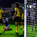 Coleby Shepherd is brought down for the late Whitby Town penalty.
