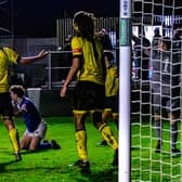 Coleby Shepherd is brought down for the late Whitby Town penalty.